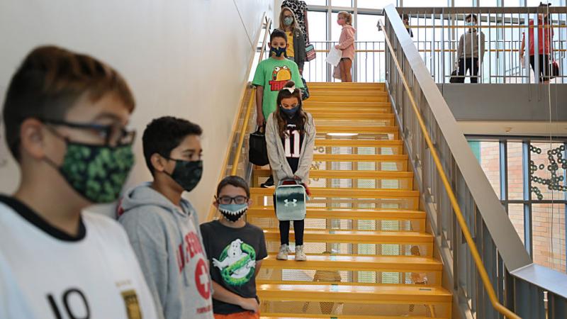 Massachusetts schoolchildren wait to go into lunch