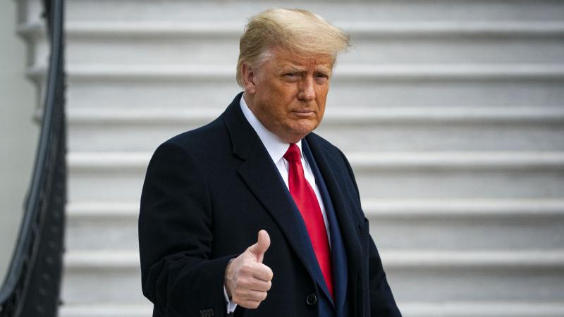U.S. President Donald Trump gives a thumbs up as he departs on the South Lawn of the White House, on December 12, 2020 in Washington, DC. Trump is traveling to the Army versus Navy Football Game at the United States Military Academy in West Point, NY.