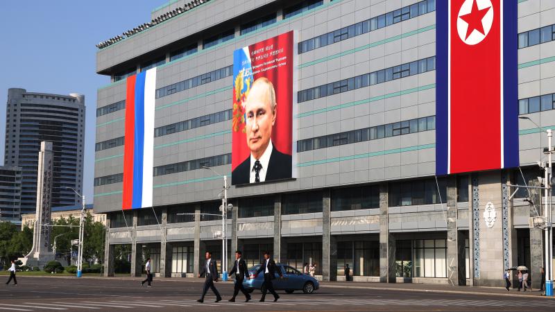 A picture of Russia's President Vladimir Putin on a billboard is seen on a buildingon June 18, 2024, in Pyongyang, North Korea.