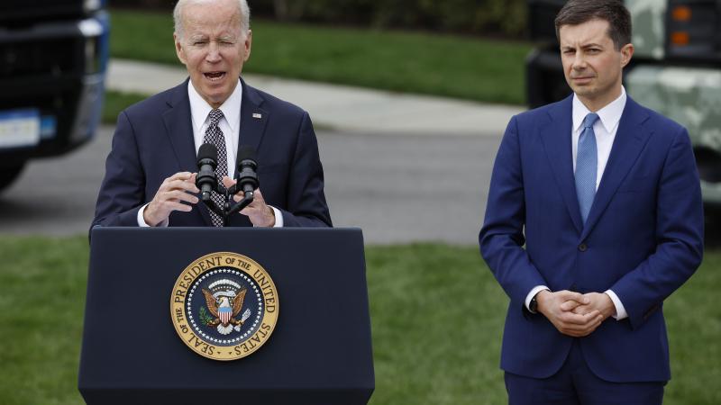 Buttigieg next to Biden at podium 