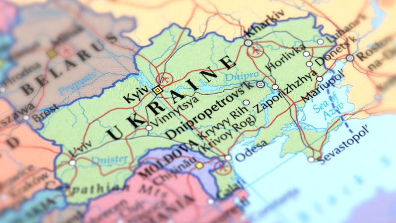 Map of green Ukraine on a globe